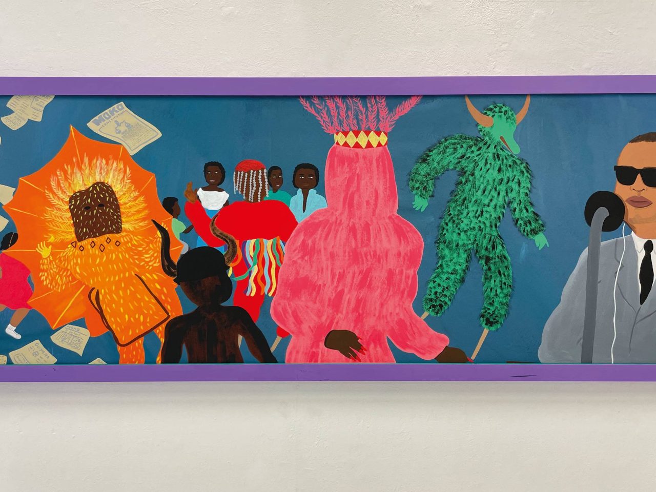 A painting of colourful figures from Carnival. In the background are several black adults looking around and a child. Paper is floating down from the air with Moko written on it. A painting that has a lilac wooden frame.